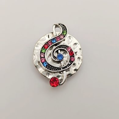 Broche aimantée "Médaillon argenté clé de sol strass"