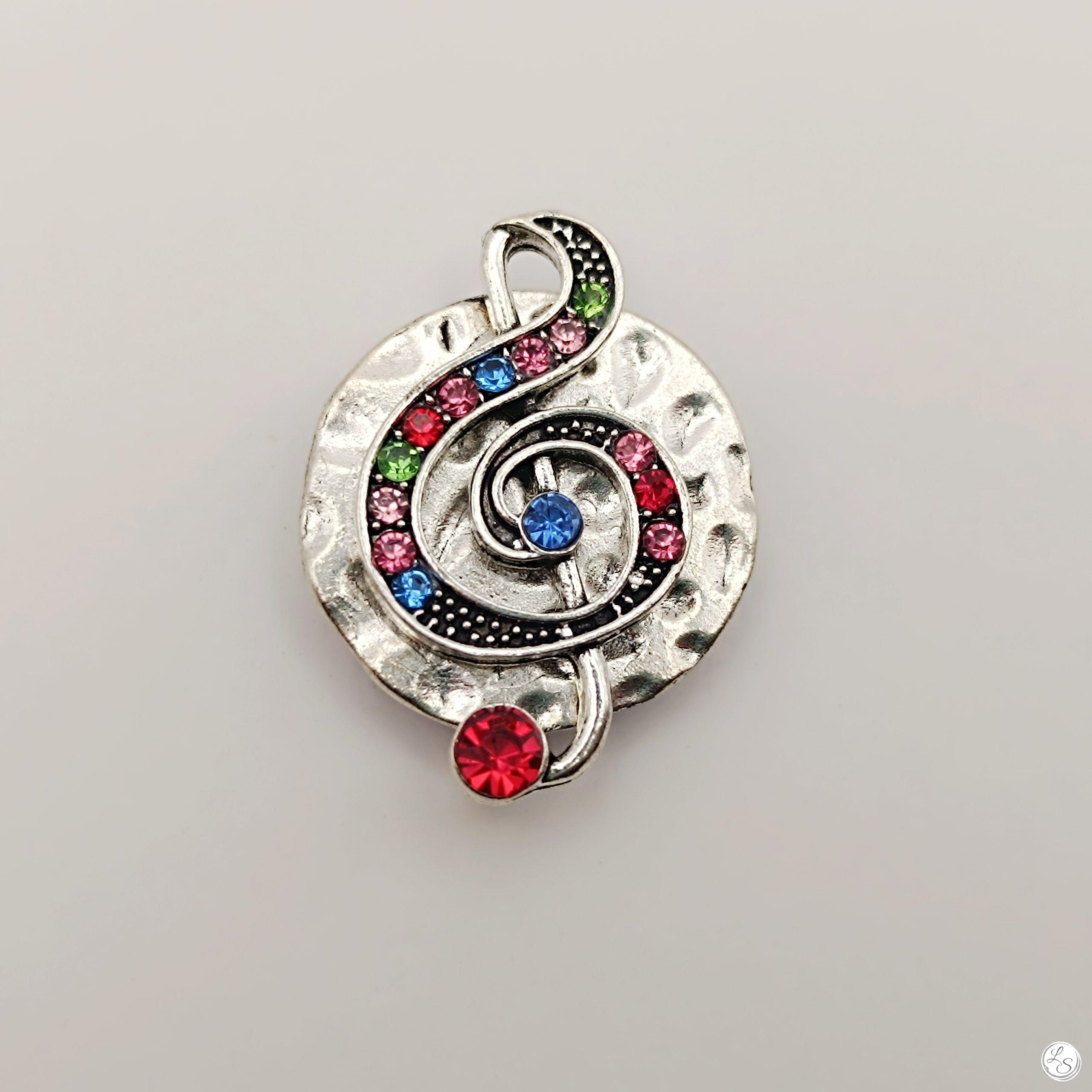 Broche aimantée "Médaillon argenté clé de sol strass"